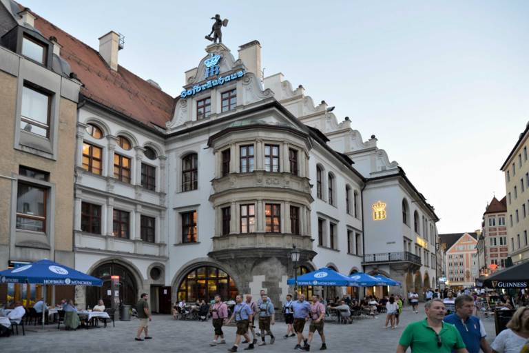 Exterior view of the Hofbräuhaus Munich at dusk.