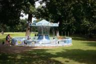 Chain carousel for children on the playground in the Hirschgarten beer garden in Munich.