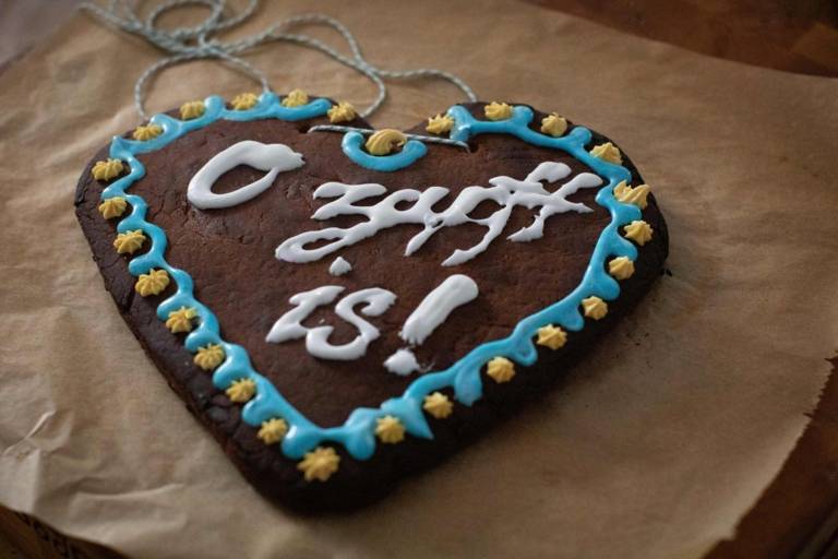 A homemade gingerbread heart with decoration.